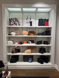 Photo of WARSAW, POLAND - JULY 13, 2022: Fashion store display with bags in shopping mall