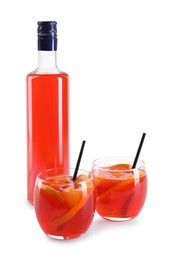 Photo of Aperol spritz cocktail, straws and orange slices in glasses isolated on white