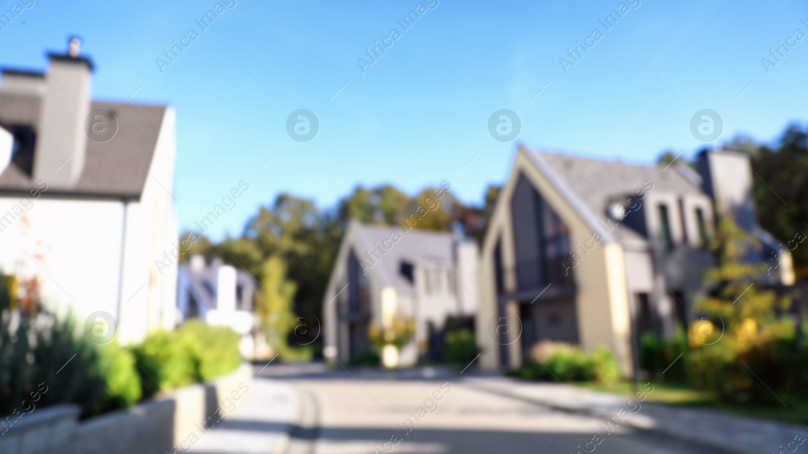 Photo of Landscape with new modern houses on sunny day, blurred view