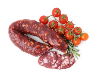 Delicious cut smoked sausage, tomatoes and rosemary isolated on white, top view