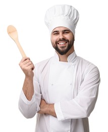 Photo of Happy young chef in uniform holding wooden spoon on white background