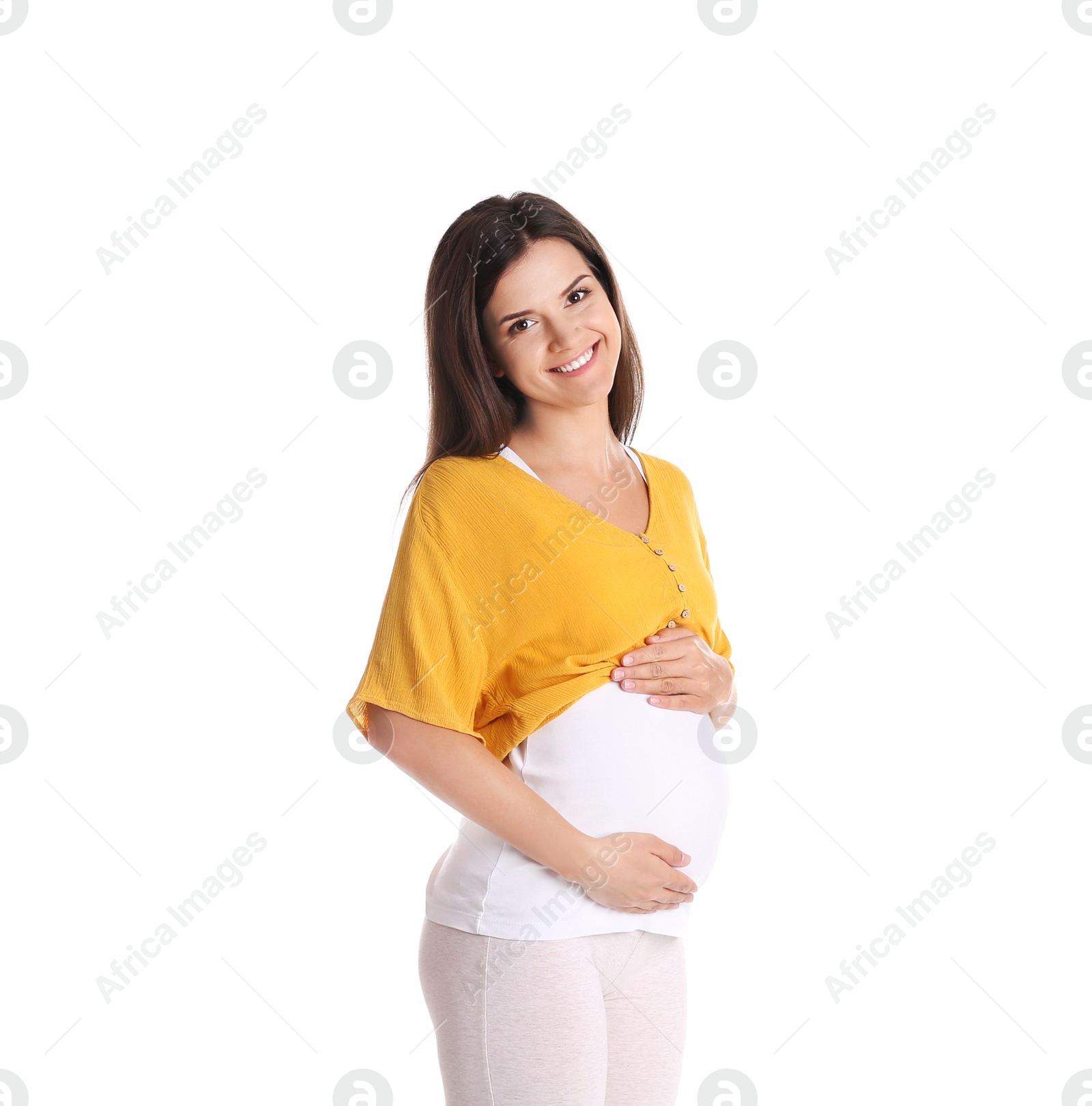 Photo of Happy pregnant woman posing on white background