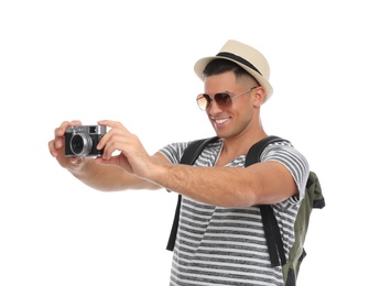 Photo of Man with straw hat taking picture on white background. Summer travel