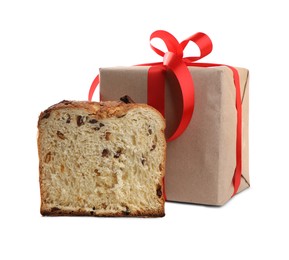 Half of delicious Panettone cake and gift box on white background. Traditional Italian pastry