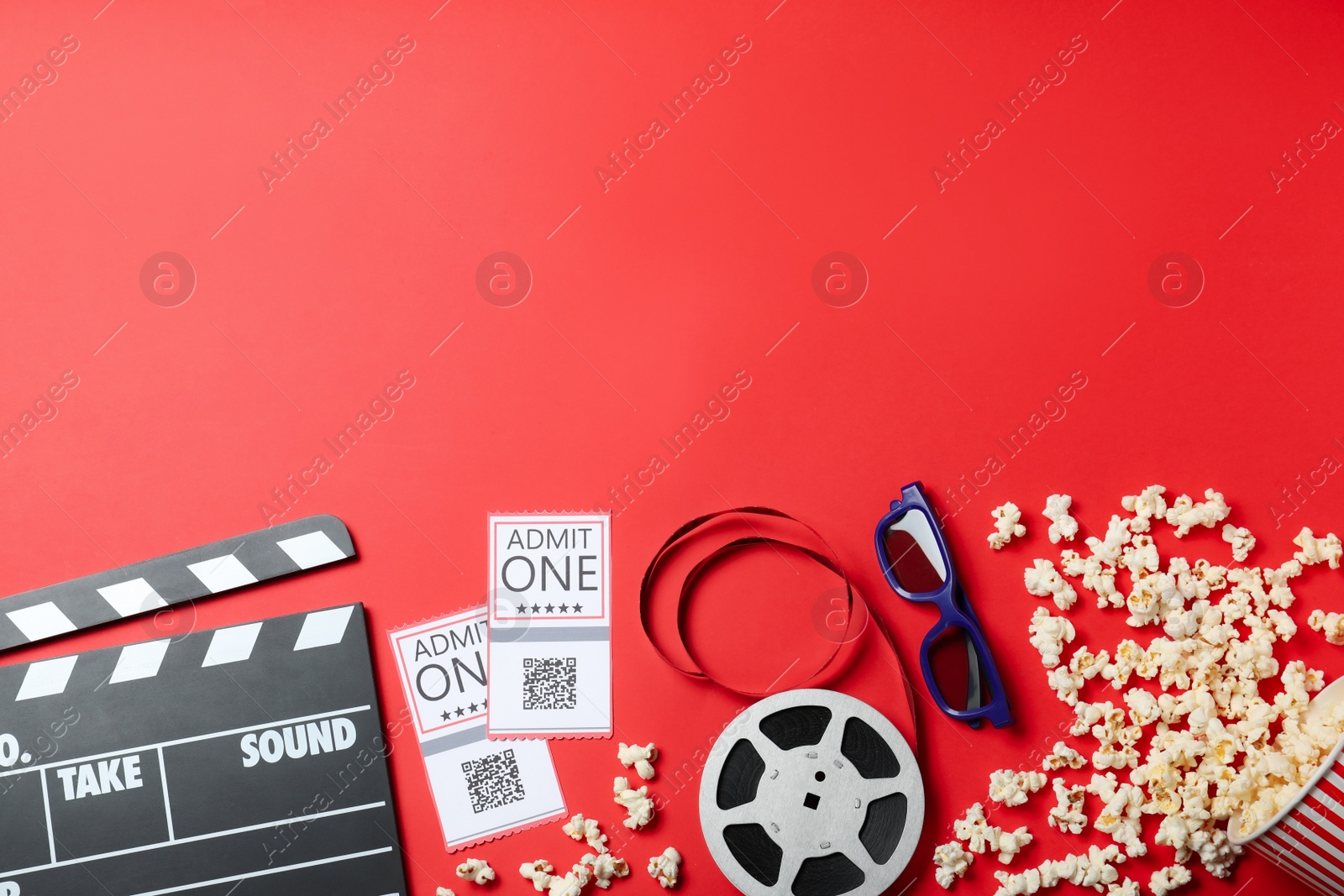 Photo of Flat lay composition with cinema tickets on red background, space for text