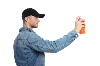 Photo of Handsome man holding spray paint against white background