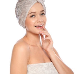 Photo of Portrait of young pretty woman with towels on white background