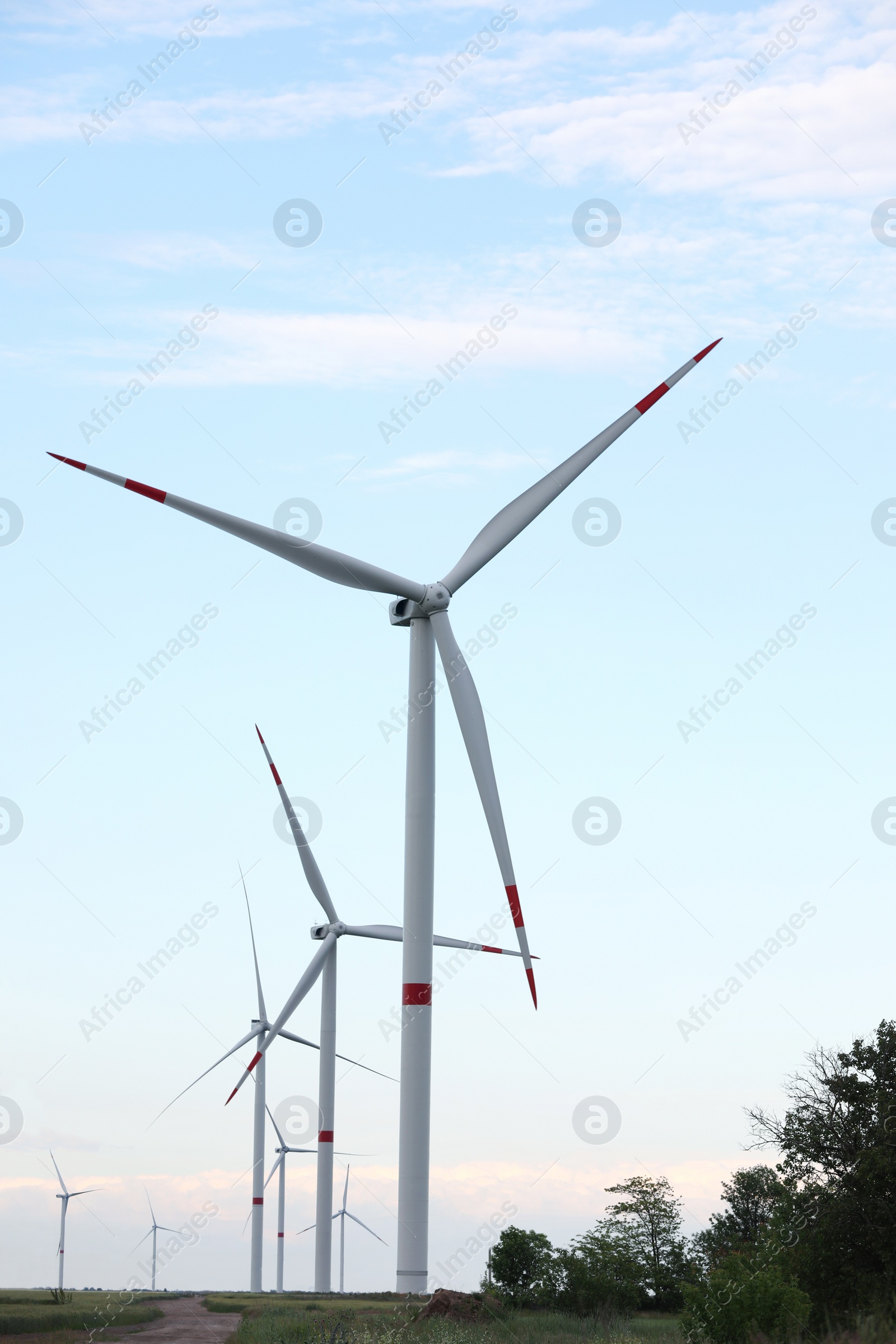 Photo of Beautiful view of landscape with wind turbines in evening. Alternative energy source