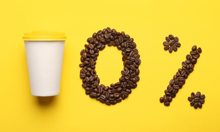 Photo of 0 percent made of coffee beans and paper cup on yellow background, flat lay. Decaffeinated drink