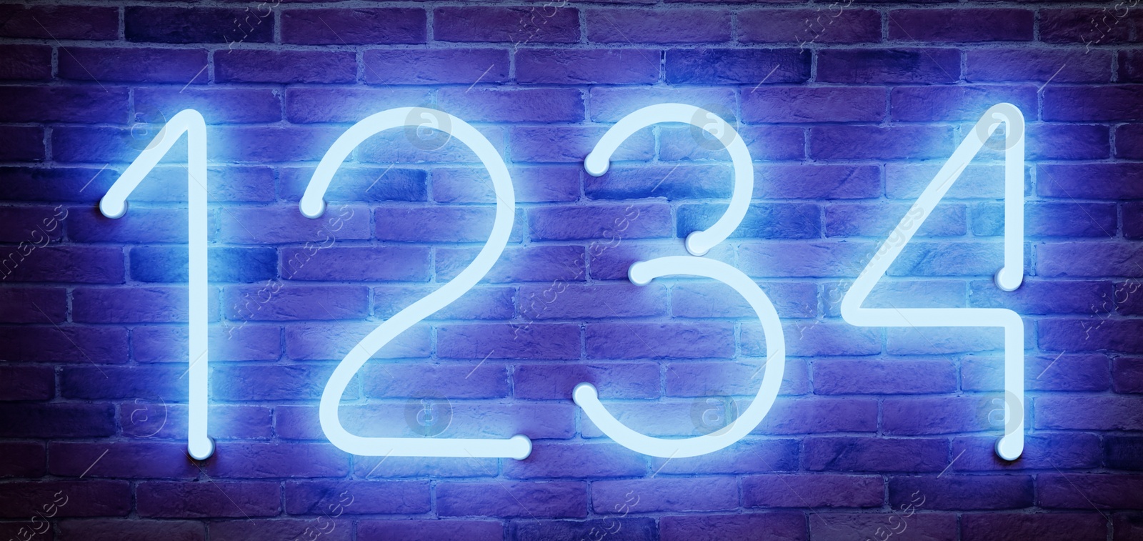 Image of Glowing neon number (1, 2, 3, 4) signs on brick wall