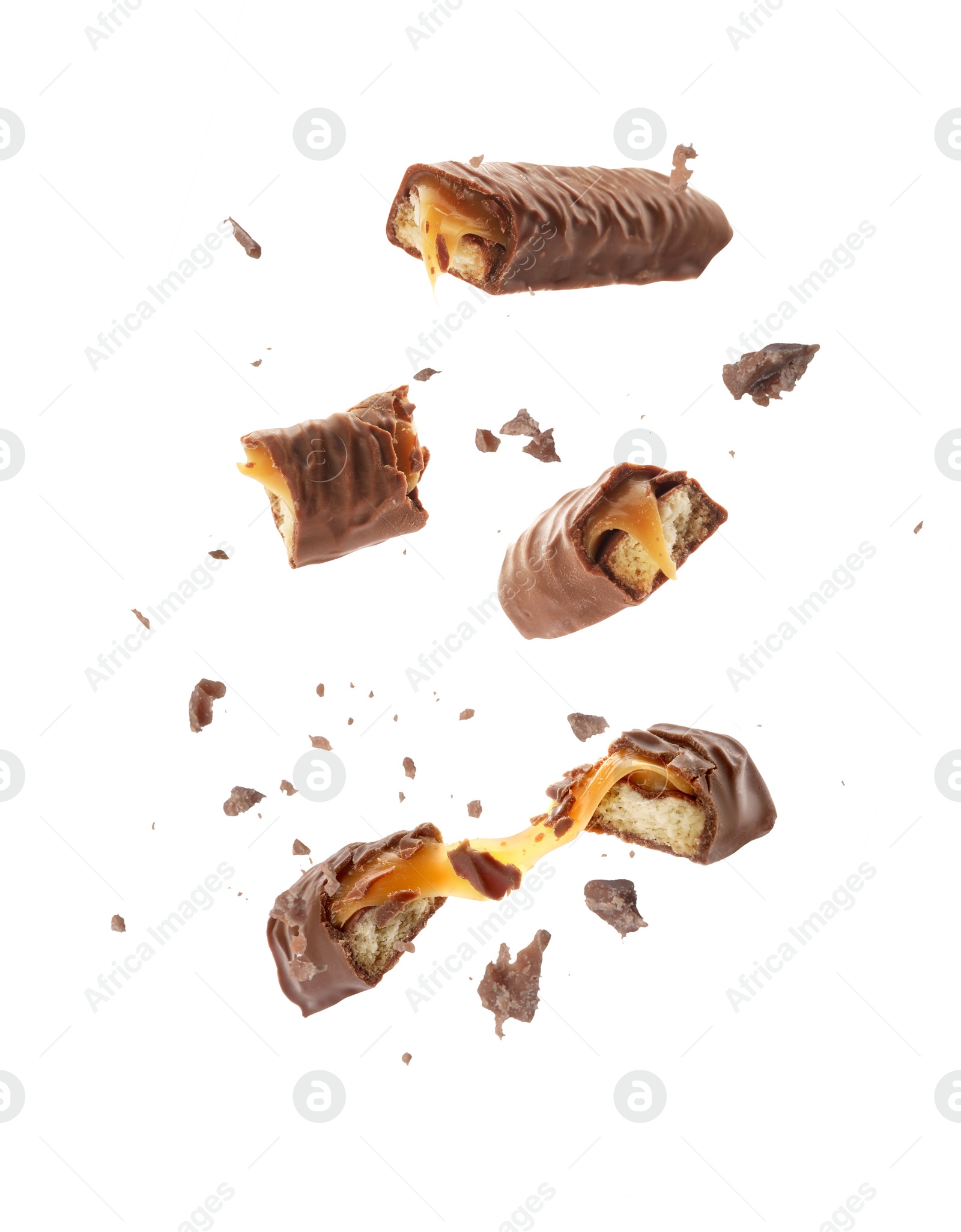 Image of Pieces of chocolate bars with caramel falling on white background