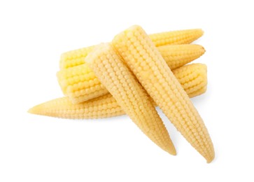 Photo of Pickled baby corn isolated on white, top view