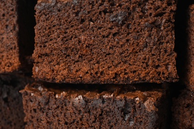 Photo of Fresh brownie as background, closeup. Delicious chocolate pie