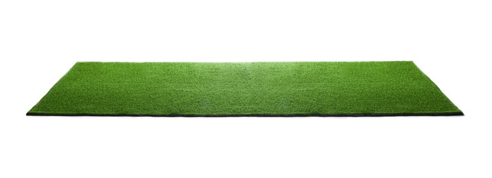 Photo of Green artificial grass carpet isolated on white