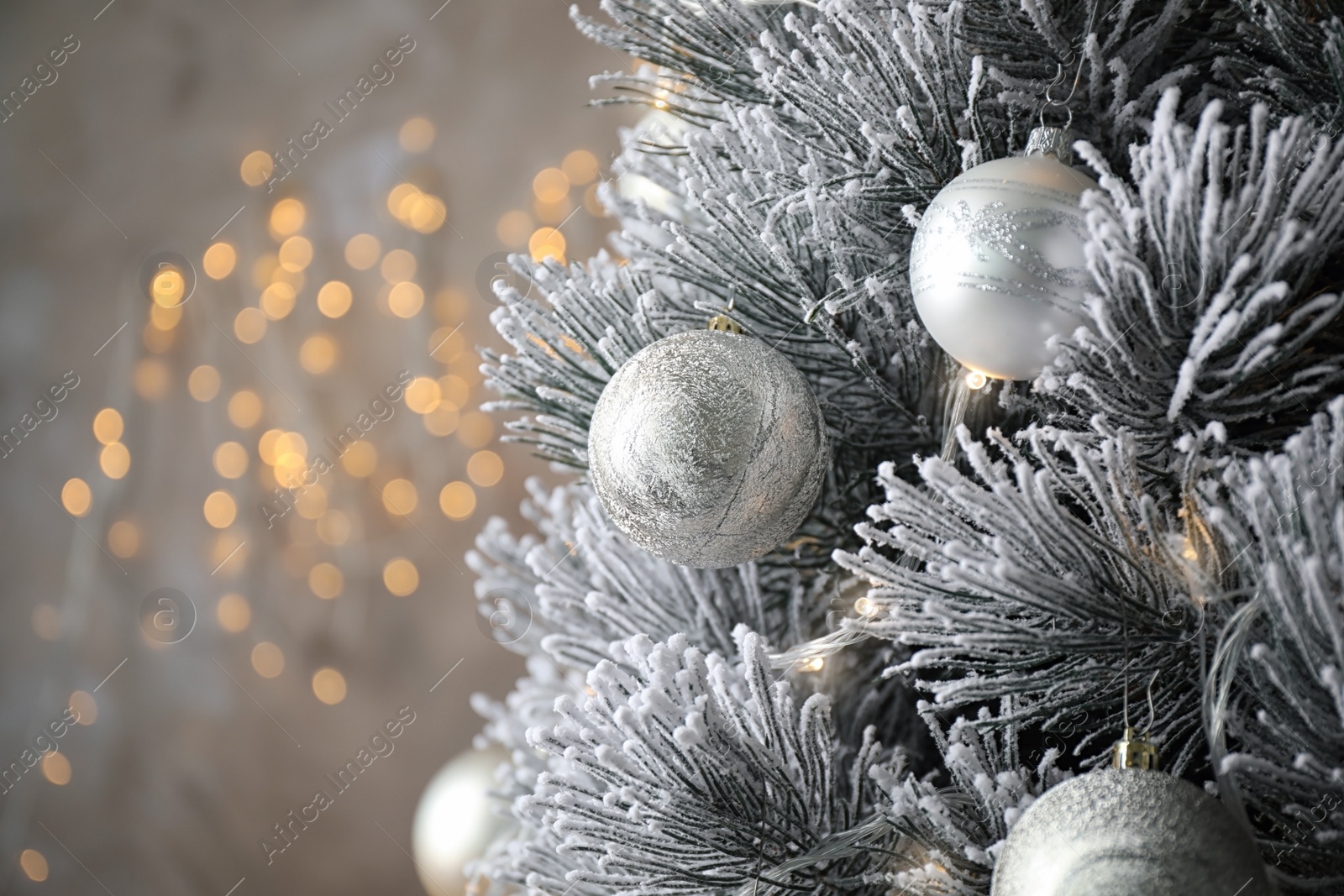 Photo of Beautiful Christmas tree with decor against blurred lights on background. Space for text