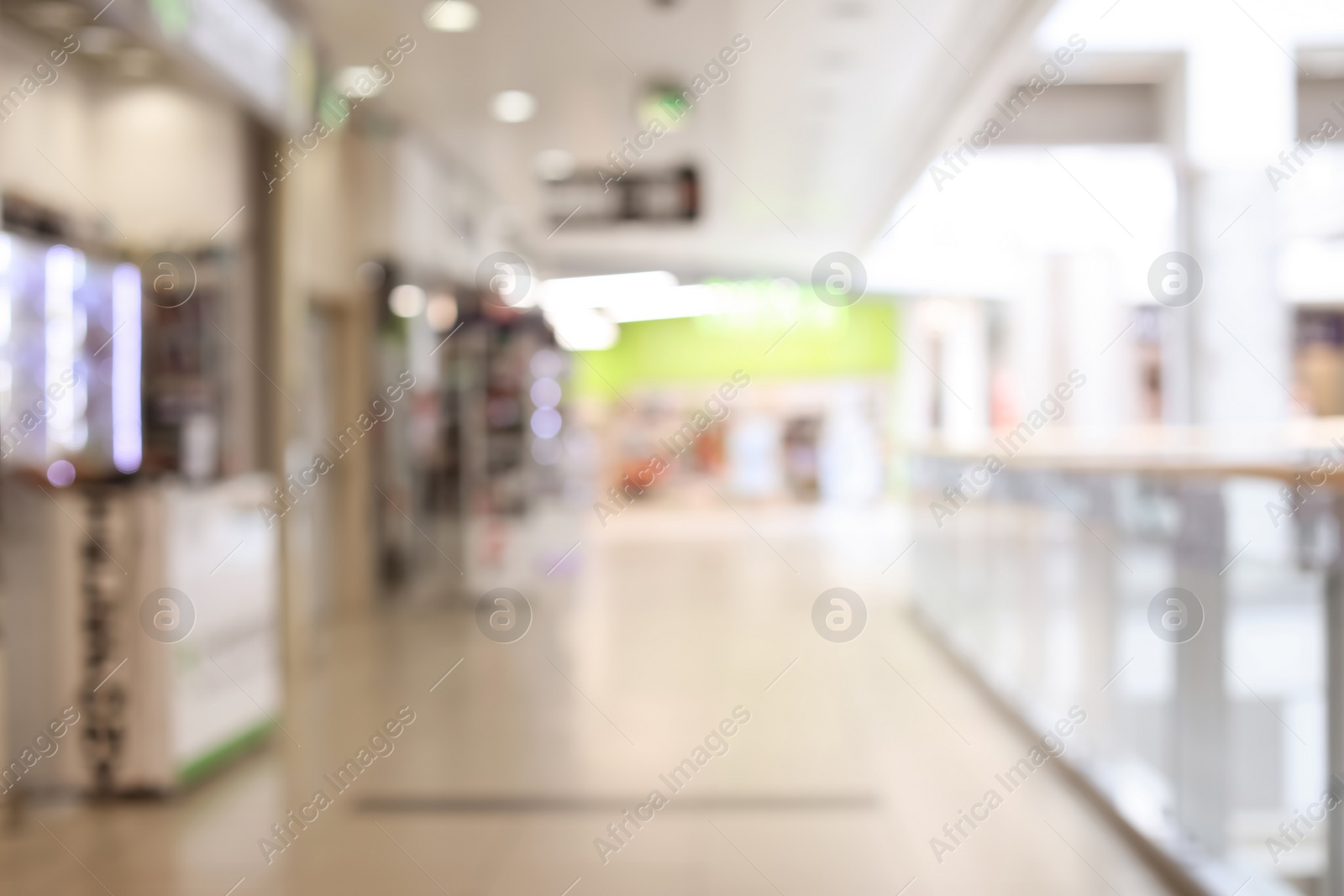 Photo of Blurred view of modern shopping mall interior