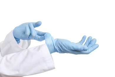 Photo of Doctor wearing light blue medical gloves on white background, closeup