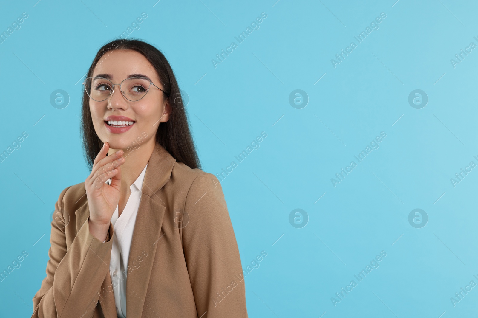 Photo of Beautiful woman wearing glasses on turquoise background, space for text