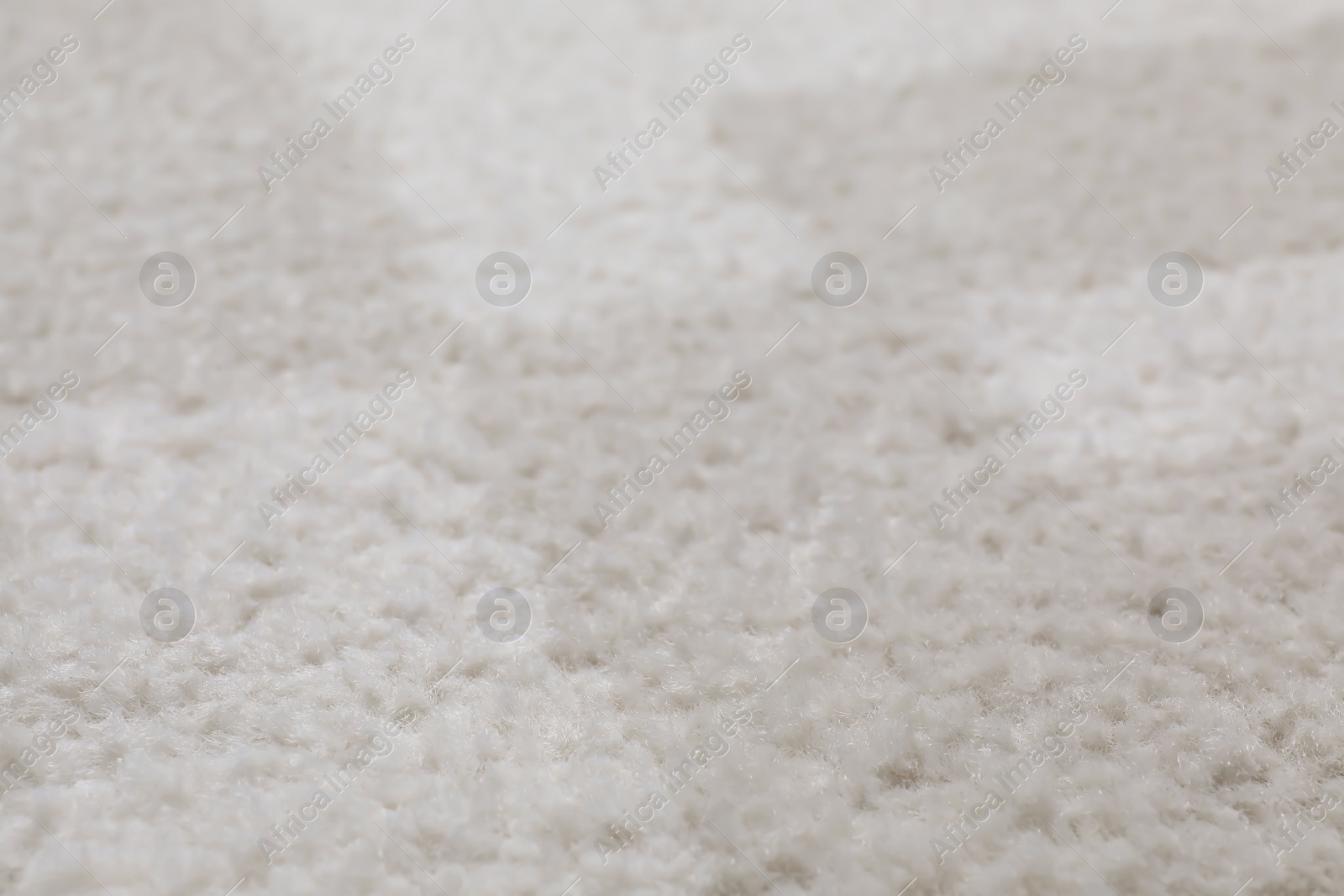 Photo of Fuzzy carpet texture as background, closeup view