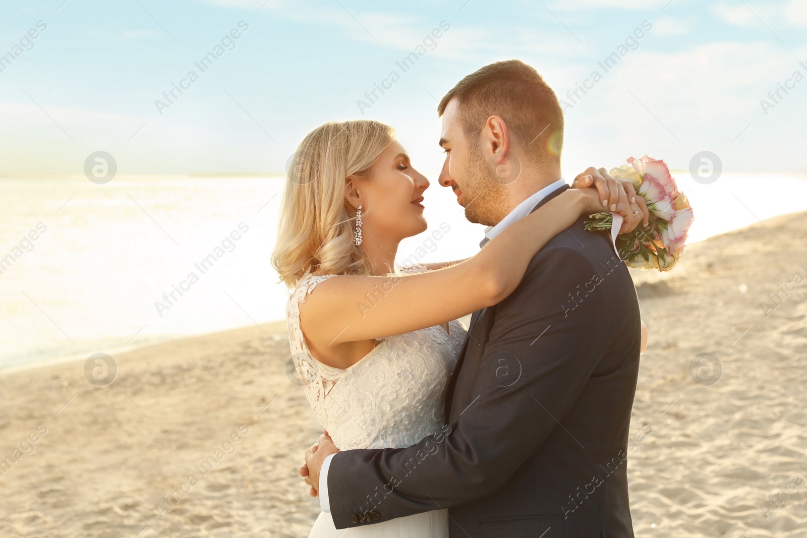 Photo of Wedding couple. Bride and groom on beach