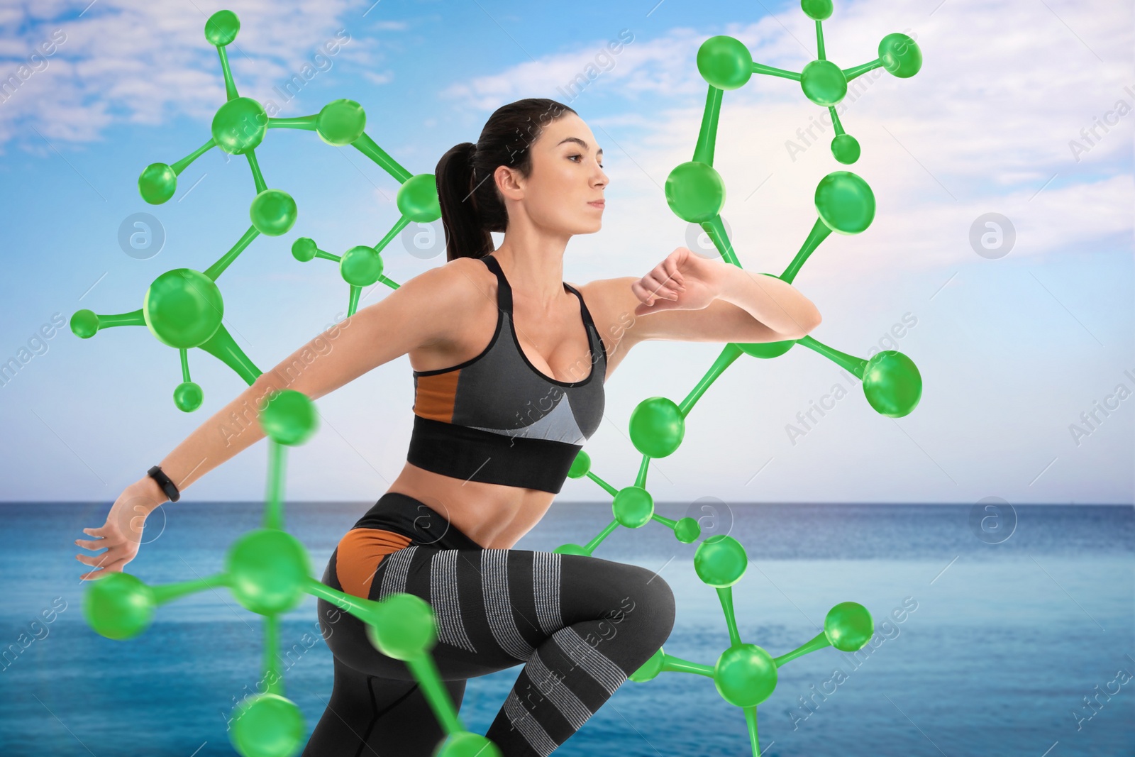 Image of Metabolism concept. Molecular chain illustration and athletic young woman running near sea on sunny day