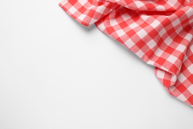 Photo of Red checkered tablecloth on white background, top view