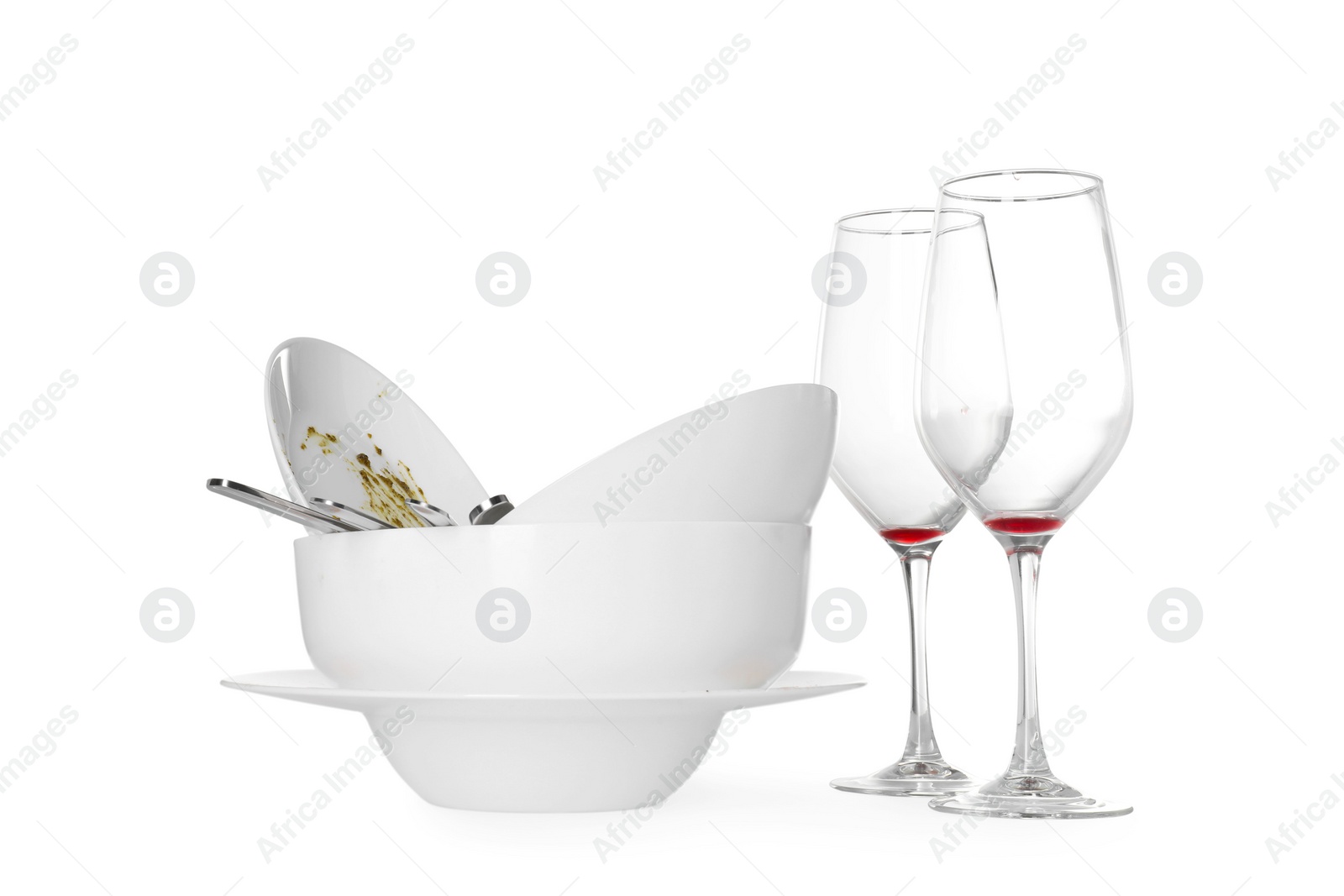 Photo of Many dirty dishes and glasses isolated on white