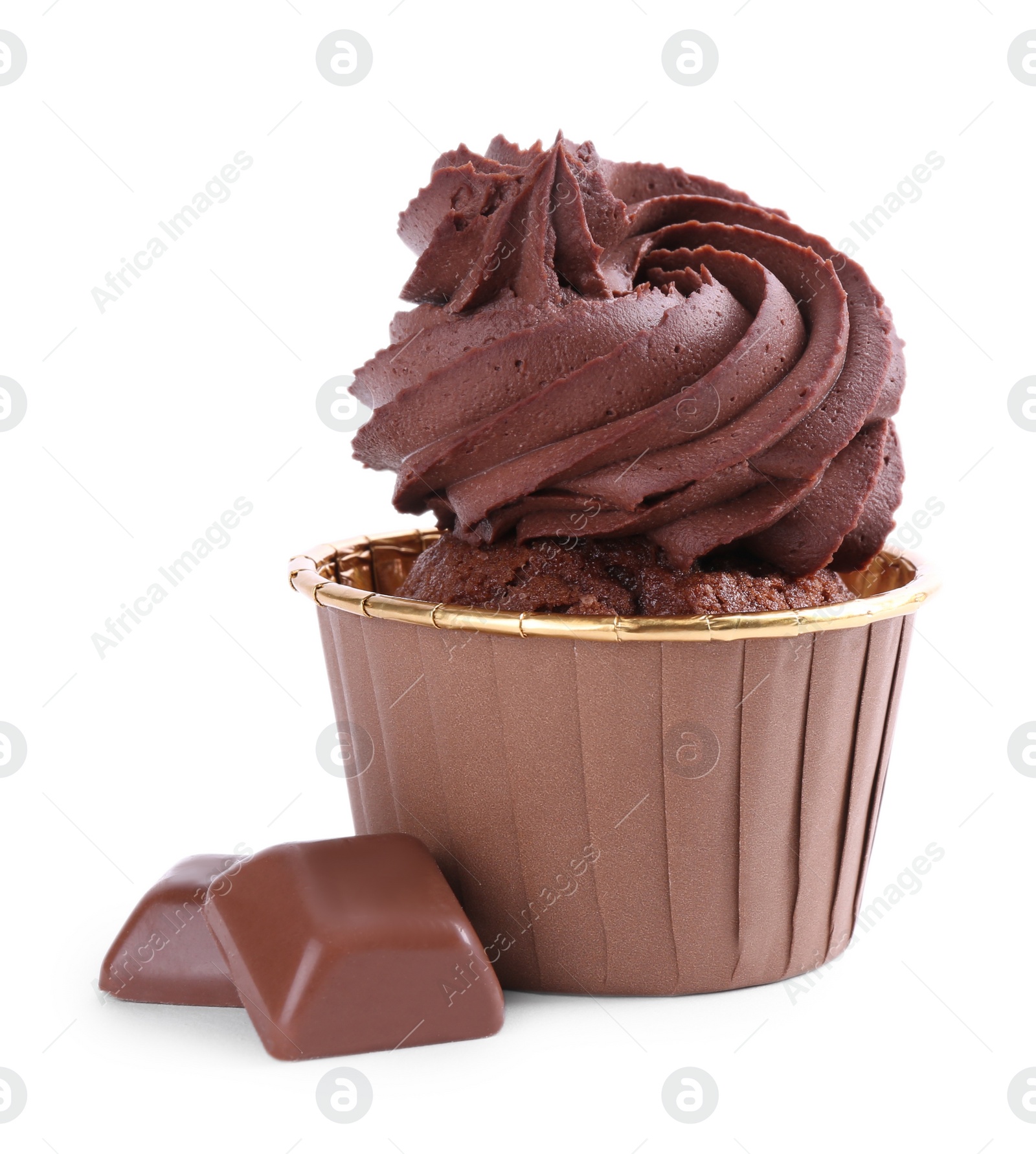 Photo of One delicious cupcake and chocolate pieces isolated on white