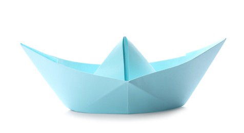 Handmade light blue paper boat isolated on white. Origami art