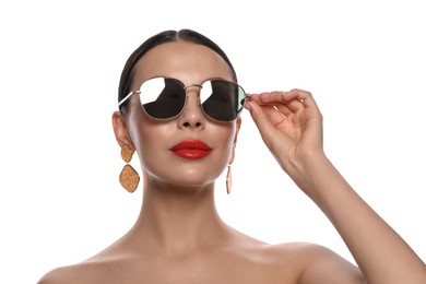 Photo of Attractive woman wearing fashionable sunglasses on white background