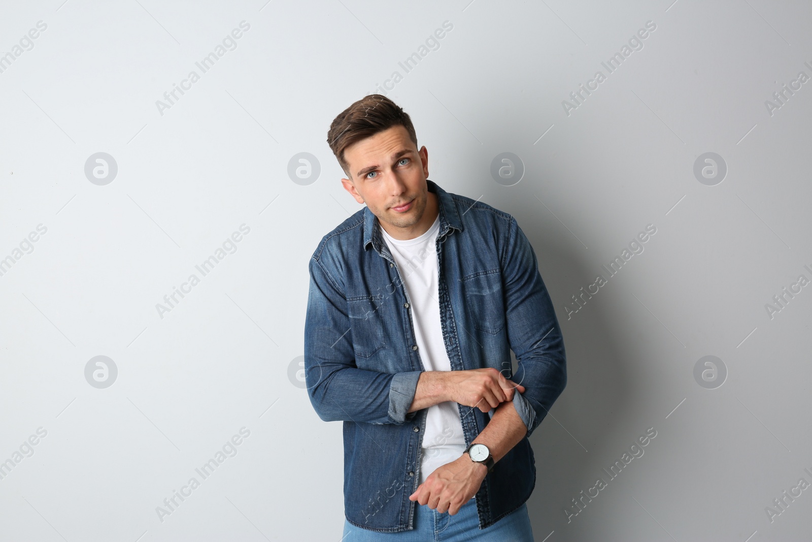 Photo of Portrait of handsome man on light background