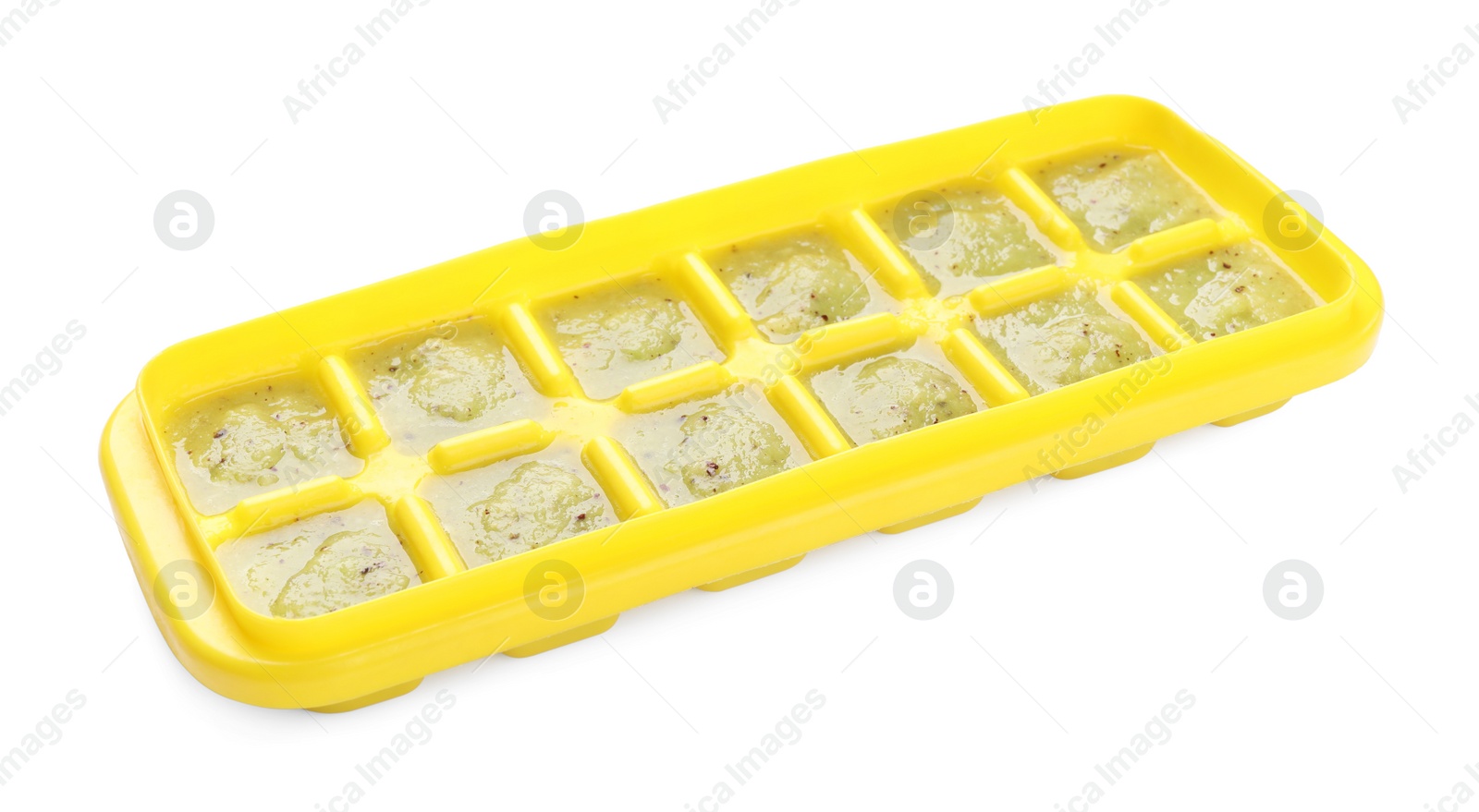 Photo of Kiwi puree in ice cube tray isolated on white. Ready for freezing