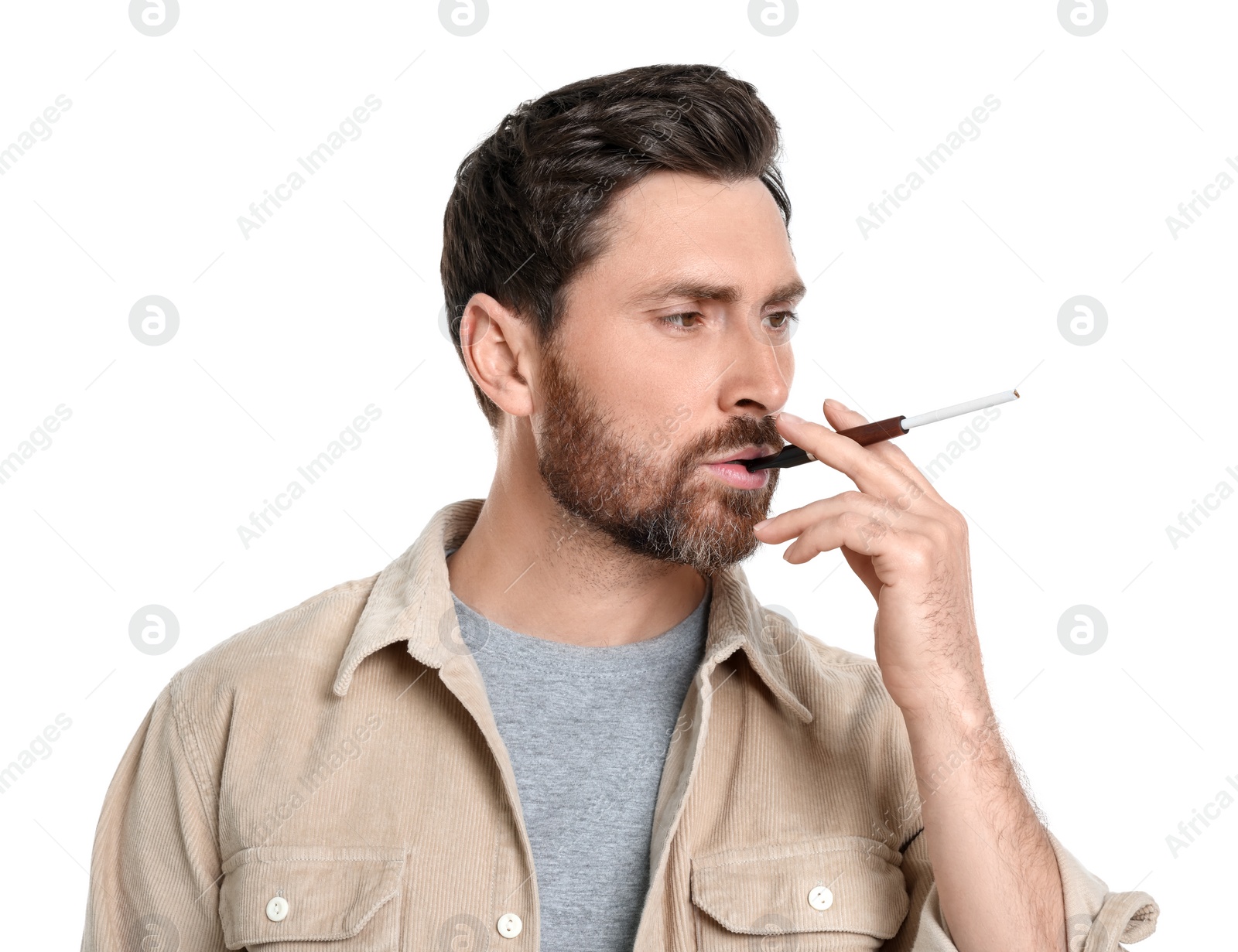 Photo of Man using cigarette holder for smoking isolated on white