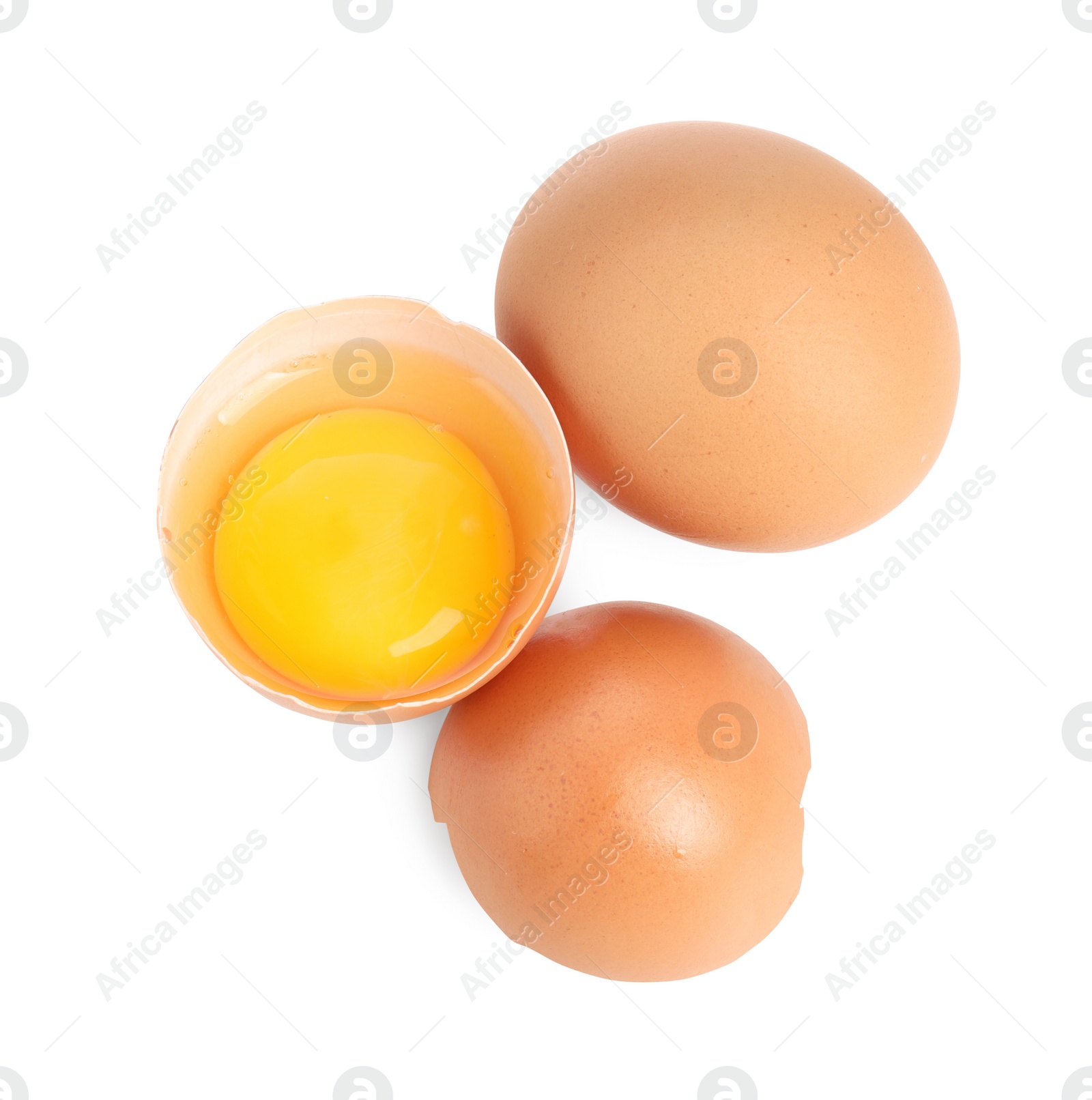 Photo of Whole and cracked chicken eggs isolated on white, top view