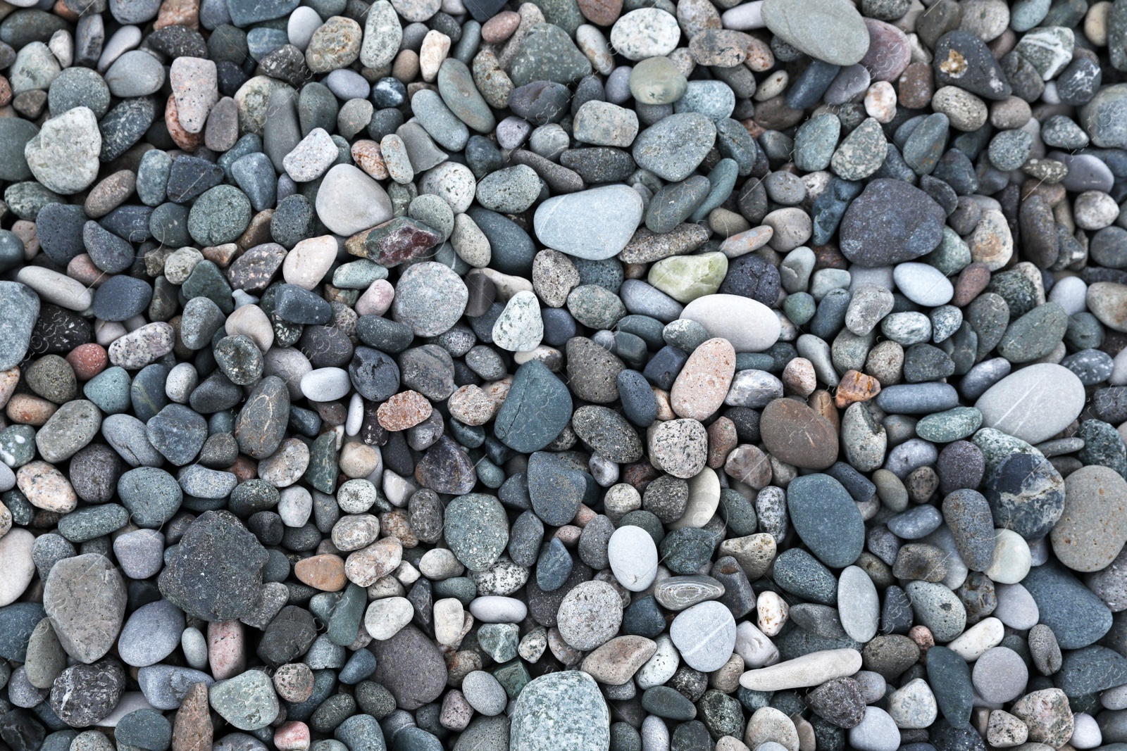 Photo of Many different pebbles as background, top view