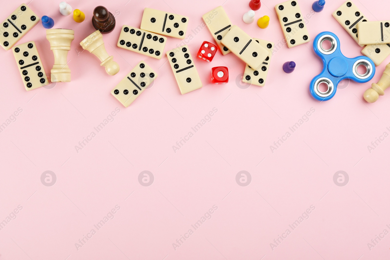 Photo of Components of board games on pink background, flat lay. Space for text