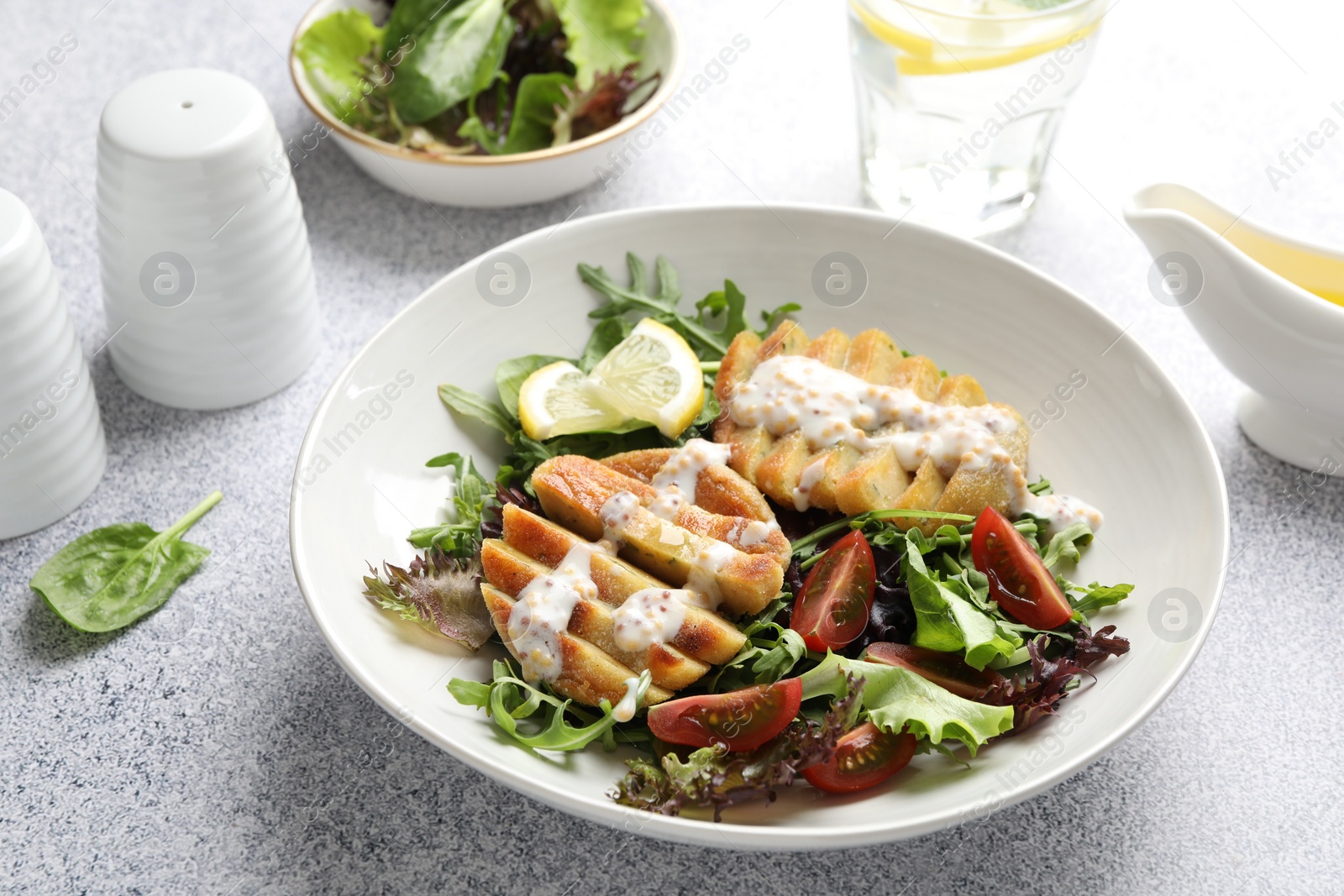 Photo of Healthy dish high in vegetable fats on light textured table, closeup