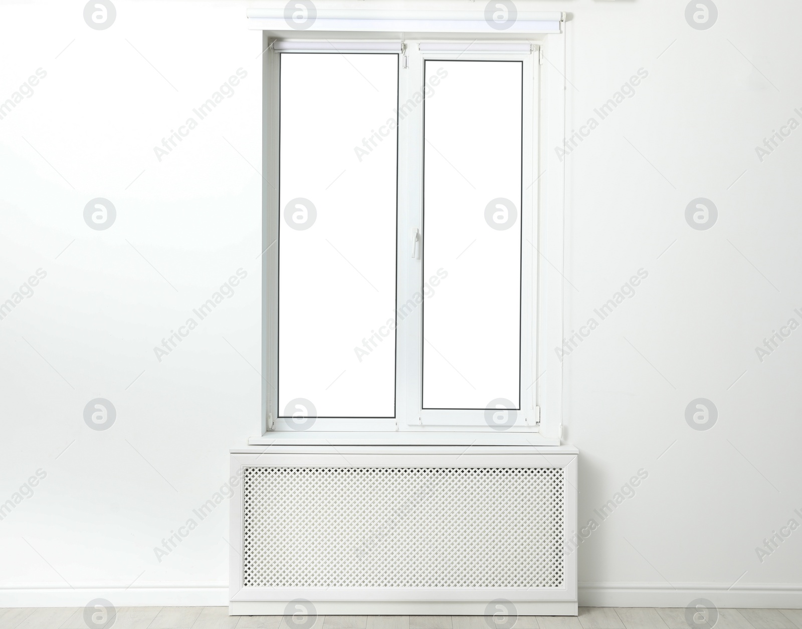 Photo of White wall with modern window in empty room