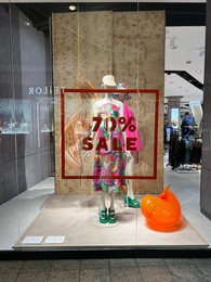 Photo of WARSAW, POLAND - JULY 17, 2022: Fashion store display with women clothes in shopping mall