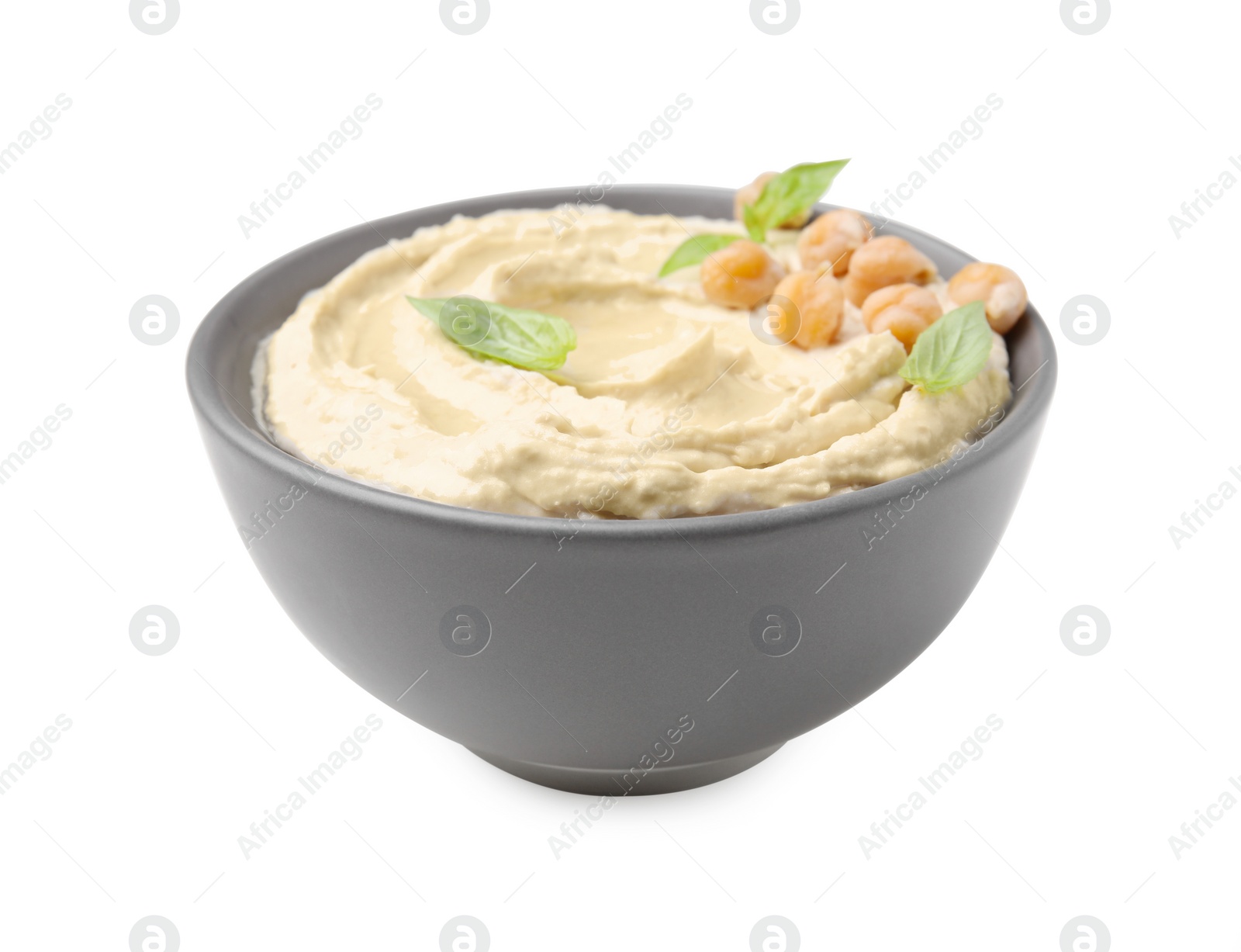 Photo of Bowl of delicious hummus with chickpeas isolated on white