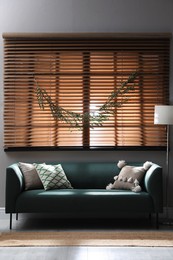 Photo of Stylish room decorated with beautiful eucalyptus garland