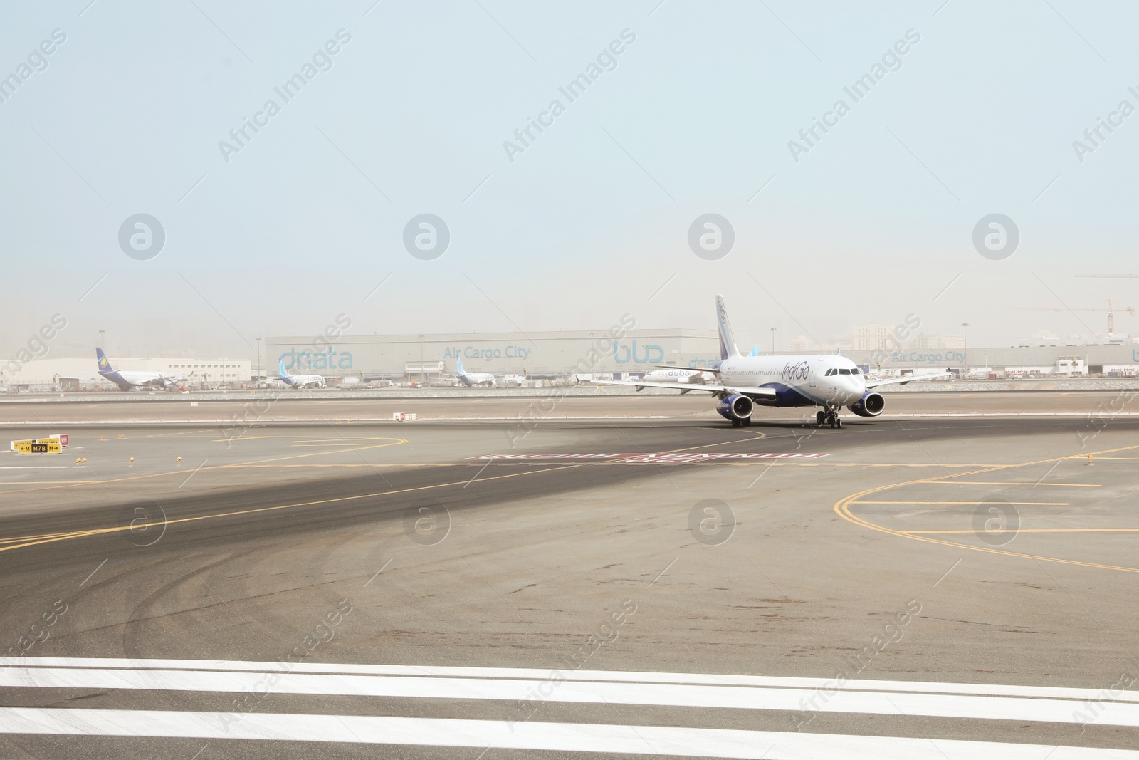Photo of DUBAI, UNITED ARAB EMIRATES - NOVEMBER 06, 2018: Airport landing zone with IndiGo plane