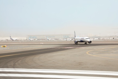 DUBAI, UNITED ARAB EMIRATES - NOVEMBER 06, 2018: Airport landing zone with IndiGo plane