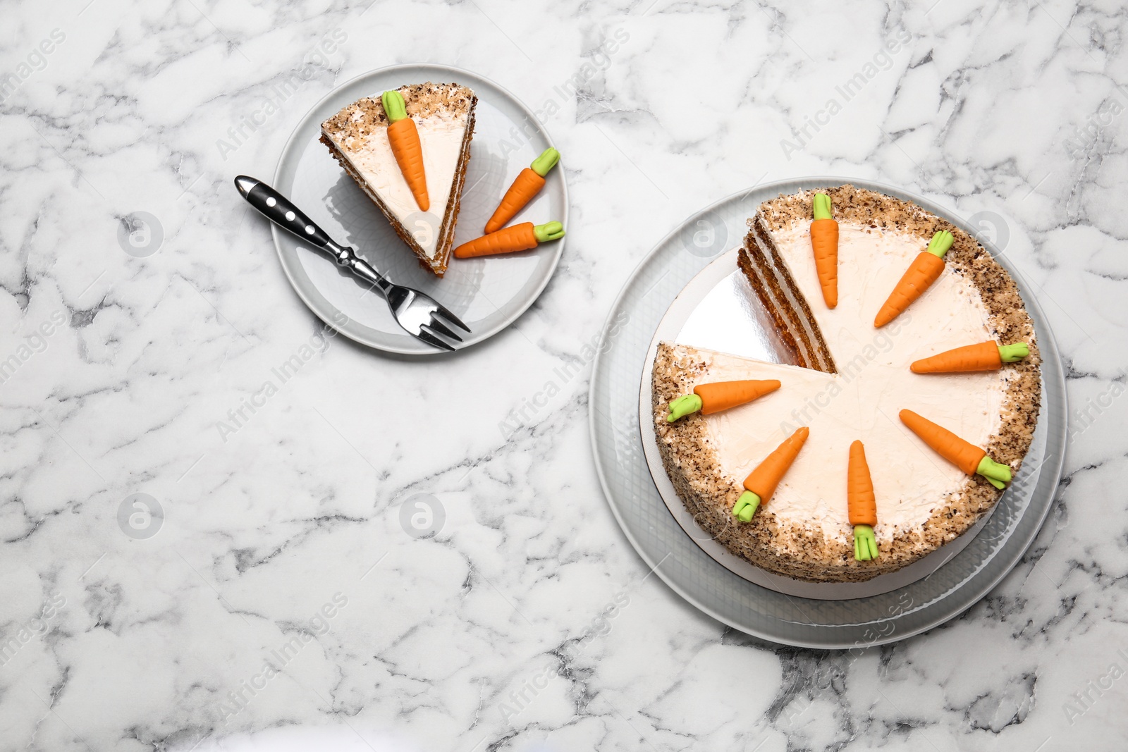 Photo of Flat lay composition with sweet carrot cake on white marble table. Space for text