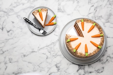 Photo of Flat lay composition with sweet carrot cake on white marble table. Space for text