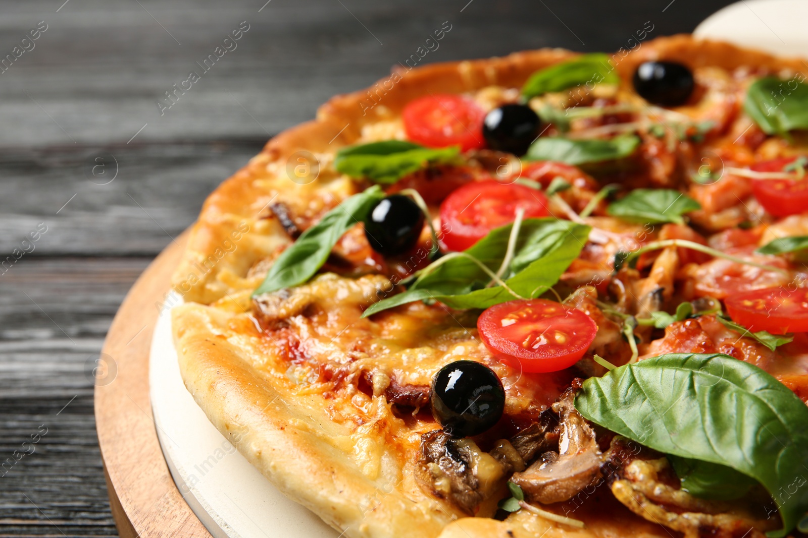 Photo of Tasty fresh homemade pizza on table, closeup