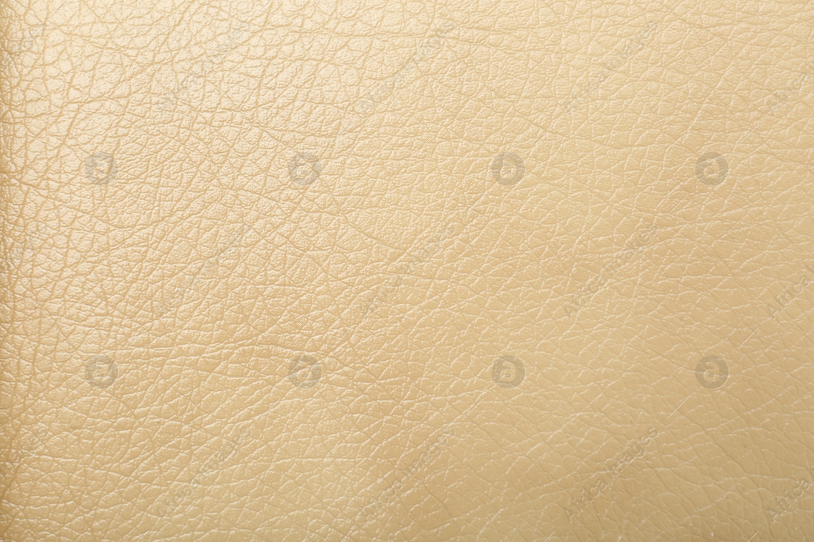 Photo of Texture of beige leather as background, closeup