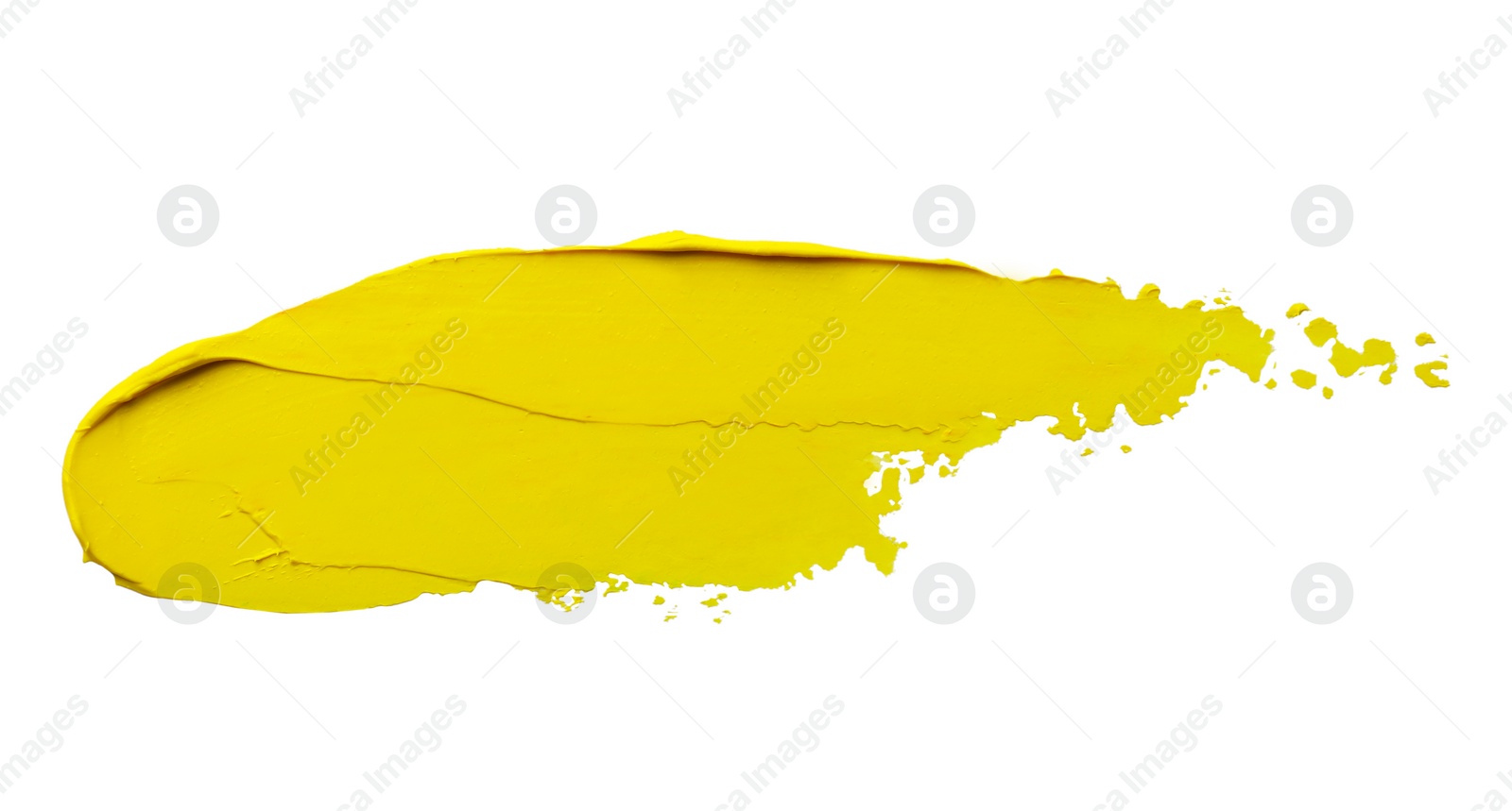 Photo of Yellow oil paint stroke on white background, top view