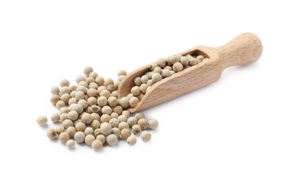 Aromatic spice. Many peppercorns in scoop isolated on white