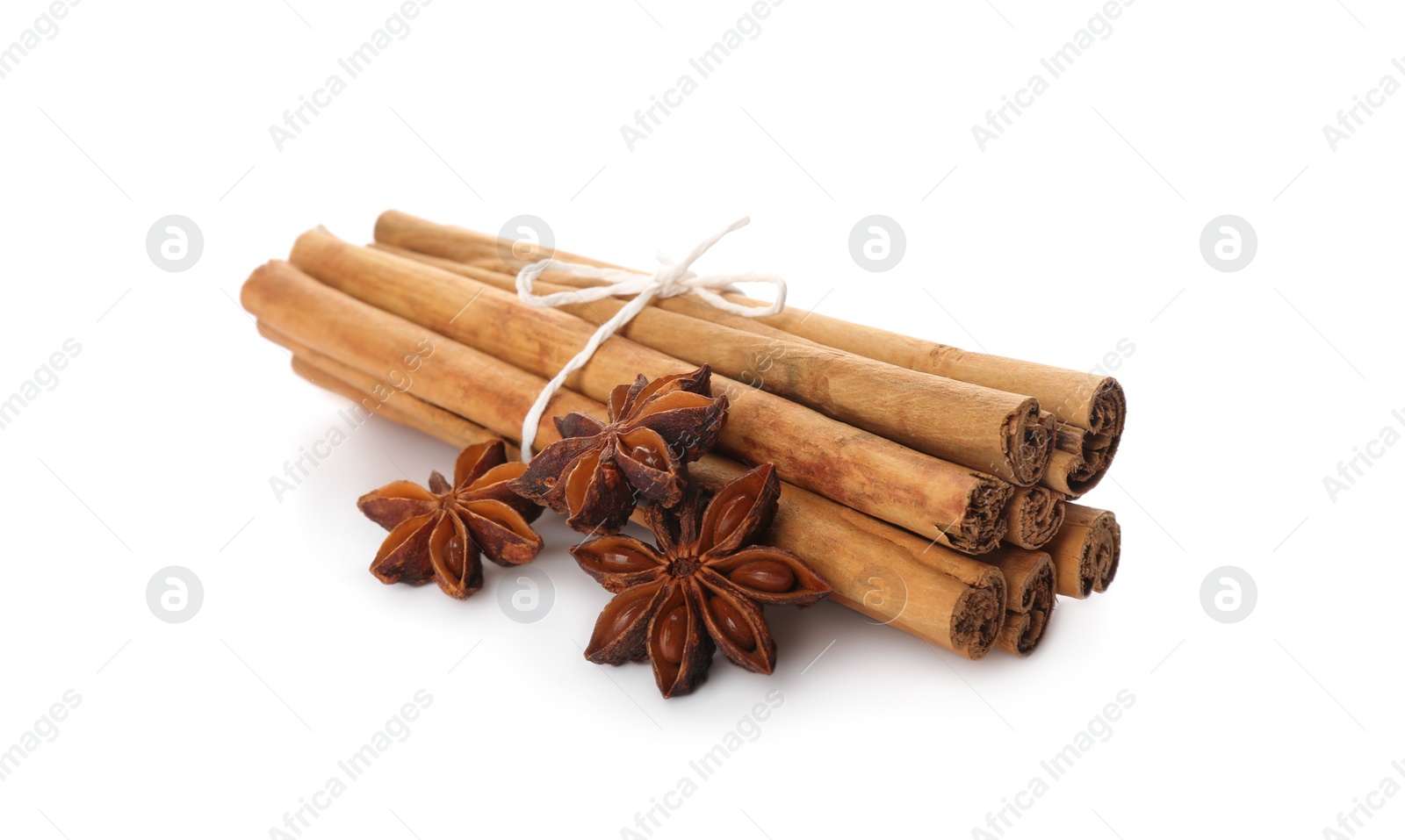 Photo of Aromatic cinnamon sticks and anise isolated on white